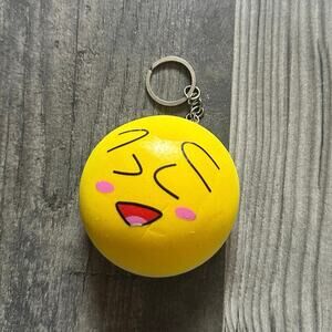 yellow silly face squishy keychain